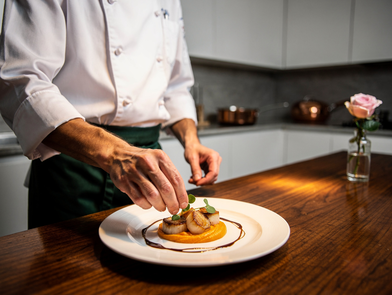 Sous Chef Elena plating a refined Italian dish