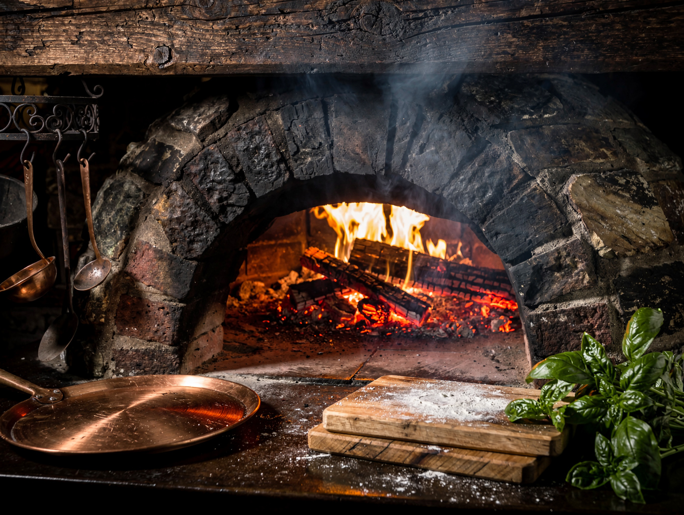 Glowing wood-fired stone hearth in an open kitchen